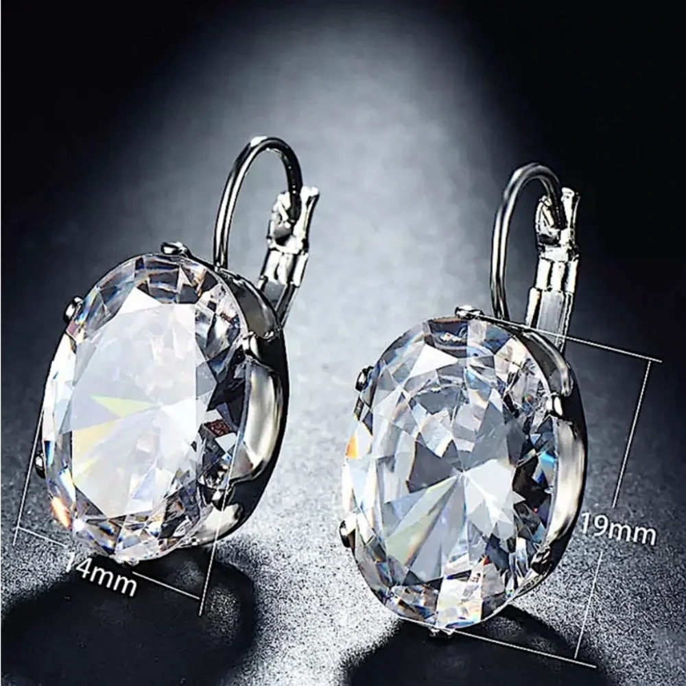 Blue Topaz Silver Oval Dangle Earrings